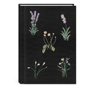 Decorative fabric journal with delicate floral black design.